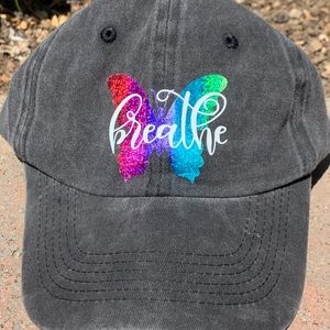 Black baseball hat with butterfly.